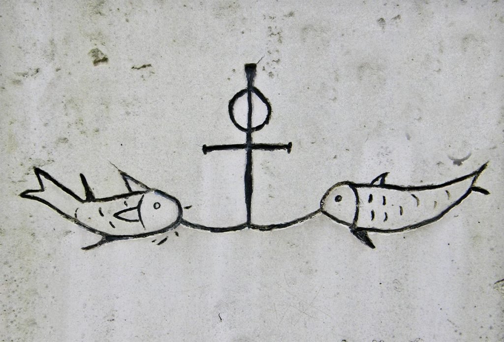 Símbolo del ancla unido al símbolo del pez